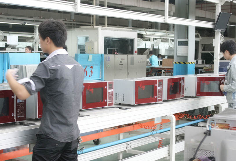 Microwave oven assembly line